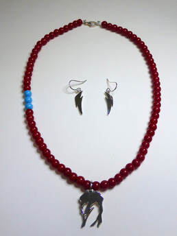 Earring and Necklace set with silver thunderbolt drop earrings and silver and red glass bead with three blue beadnecklace with profile of david bowie