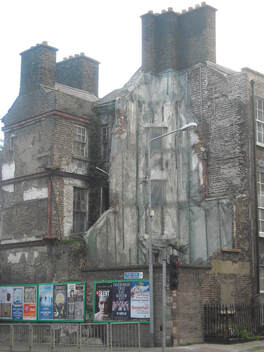 derelict corner building with exposed fireplaces